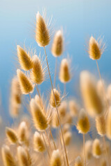 Delicate golden grasses rise against a backdrop of blue sky, creating a peaceful atmosphere that invites calm and reflection in nature in summer. Generative AI.