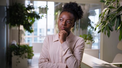 Pensive thoughtful ethnic business woman African American girl sad thinking puzzled businesswoman...