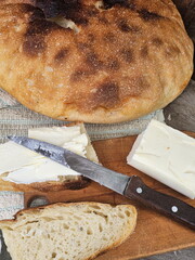 Sandwich with bread and butter on wooden background