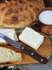 Sandwich with bread and butter on wooden background