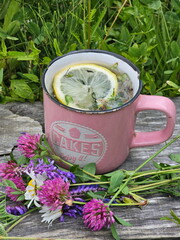 Herbal tea with lemon on wooden table