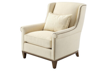 A cream colored armchair with a patterned pillow sitting on the seat against a black background
