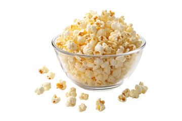 A clear glass bowl filled with popcorn and some scattered around on a black background studio shot