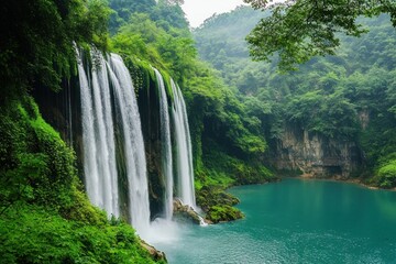 Fototapeta premium Majestic Waterfall Cascading into a Serene Emerald Lake