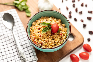 Moroccan couscous salad with fresh cherry tomatoes and raisins