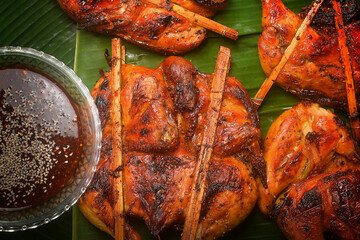 Delicious golden yellow charcoal grilled chicken.