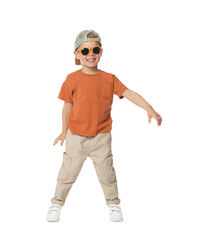 Happy little boy with sunglasses dancing on white background