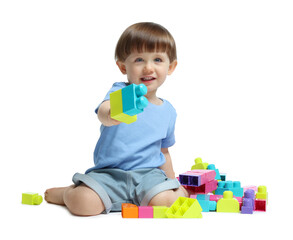 Cute little boy playing with building bricks on white background