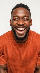 Portrait of an black man with a wide, happy smile and open arms, showing the energetic and outgoing sanguine temperament.