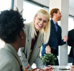 Group of young business people using laptop having a meeting or presentation and seminar in the...