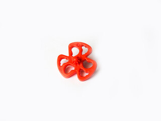 Beautiful and cute red color plastic spin toy isolated on white background.