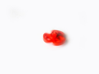 Beautiful and cute red color plastic spin toy isolated on white background.