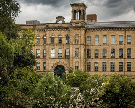 Salts Mill at the heart of the Victorian model village of Saltaire built by Titus Salt and now a world heritage site welcoming thousands of visitors and tourists every year
