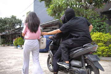 Thief On Motorbike Approaching Pedestrian Carrying A Bag