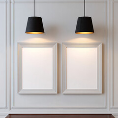 Two white frames on gray wall with black pendant lights