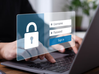 Secure login interface floats above laptop keyboard with user inputting credentials, highlighting cybersecurity and sleek design.