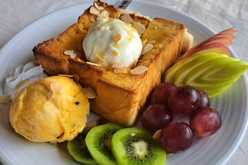 ice cream on honey toast.warm toast topped with ice cream delicious sweet dessert. Honey Toast And Ice Cream With Mixed Fruit