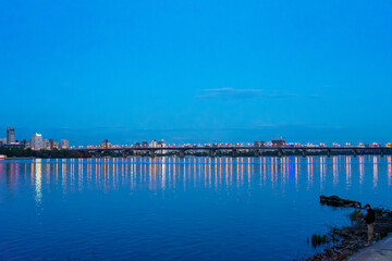 Fototapeta premium Panoramic night view of left bank of Dnypro river in Kyiv, Ukraine 