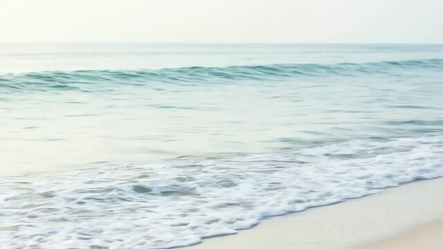 Ocean waves gently washing ashore on a tranquil beach  