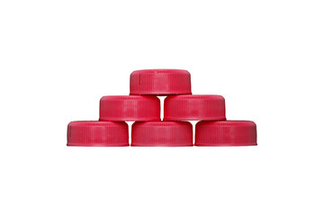 Pyramid of red plastic bottle caps is isolated.