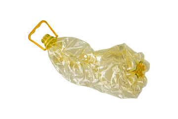 Crumpled transparent plastic bottle with yellow handle is isolated.