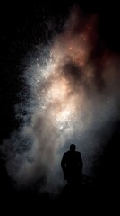 Obraz premium Dramatic silhouette of a statue against a backdrop of colorful fireworks