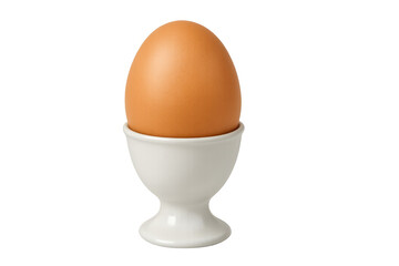 Brown egg standing in a white egg cup on transparent background