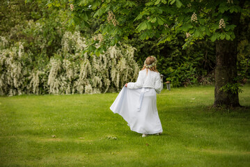 beautiful girl in a white dress in the park