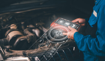 A mechanic uses augmented reality on a transparent tablet to diagnose and repair a car engine.