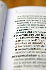 Fototapeta premium English Definition Dictionary Of Printed Word - Accumulate Close Up