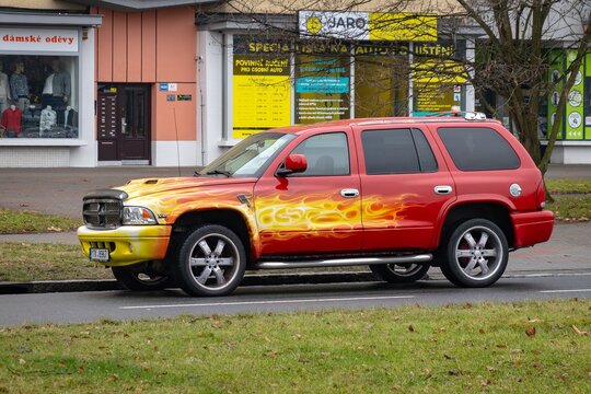 Dodge Durango Mk1 DN SUV car after tuning with large ally wheels and flames paint
