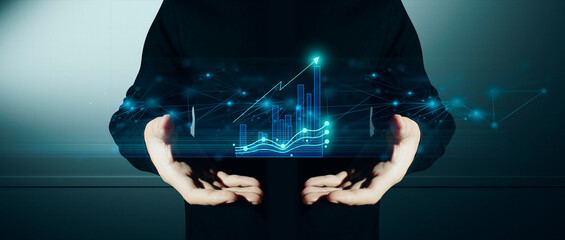 hand of businessman interactive touching a holographic of transaction financial network data...