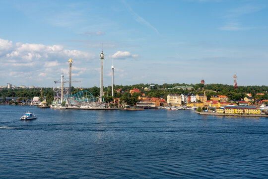 Panoramic view of Stockholm's Djurgarden with Grona Lund amusement park on a sunny summer day.