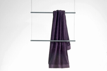 Purple towel on  the hang, close up