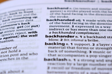 English Definition Dictionary Page Of Printed Word - Backhander  Close Up