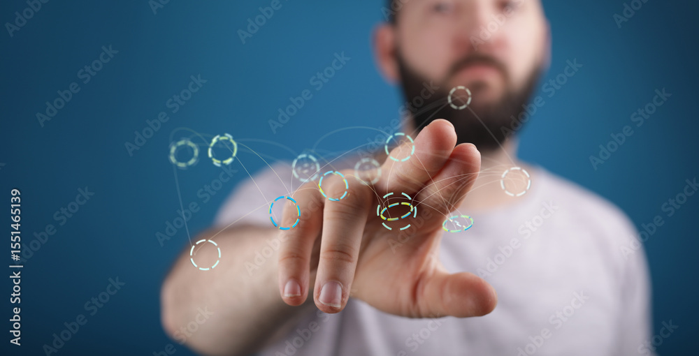 Poster Close-up of a man's hand interacting with a futuristic digital network interface.  Technology concept.