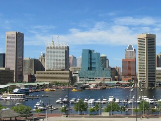 Baltimore harbor with boats and clouds 