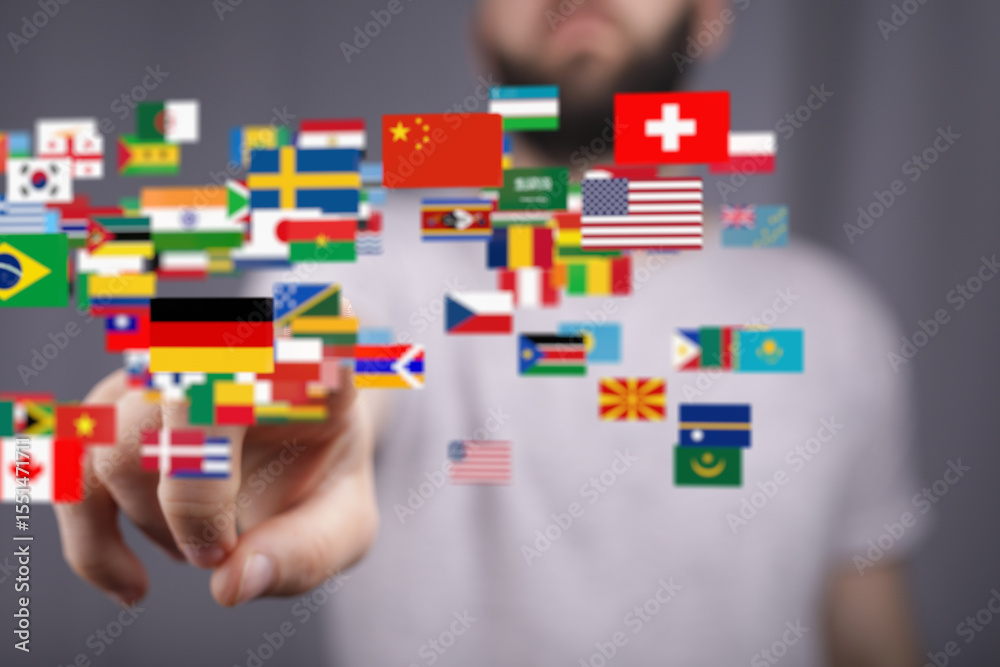 Poster diverse flags float around a person's hand, symbolizing global reach and connection.