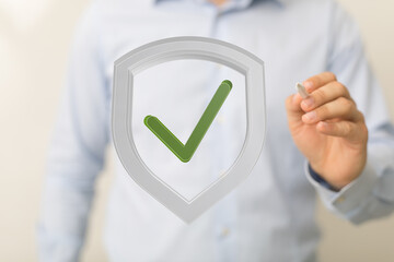 Businessman digitally signs off on secure data protection.  Safe and approved.