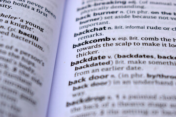Close Up Of English Dictionary Page With Definition Word -Backcomb