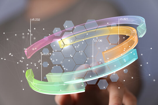 Stock photo of a person interacting with a 3D data visualization on a touchscreen.