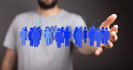 Image of a hand holding a network of blue people icons, representing social connection, teamwork,...