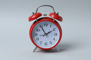 red alarm clock on white background