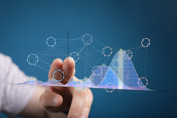 Stock photo of hand interacting with a holographic graph. Ideal for business, technology, and data analysis concepts.