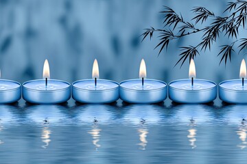 Calm blue candles on water, bamboo