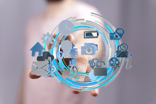 Person interacting with digital icons, representing data, connectivity, and technology.