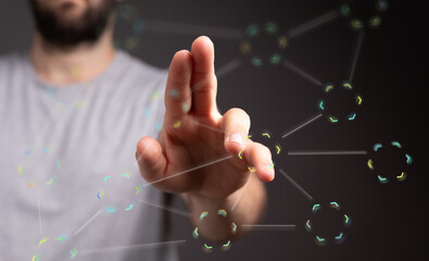Hand reaching towards a digital network, representing connectivity and technology.