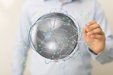 Man interacts with a digital globe, showcasing global network and technology innovation.