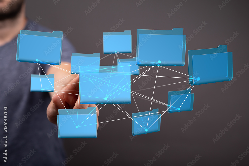 Aufkleber A man interacts with a network of digital files, illustrating data management and connectivity.