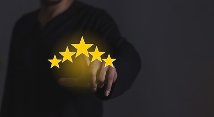 Review Customer, Young Man hand touching five star to review and give 5 stars with very good...